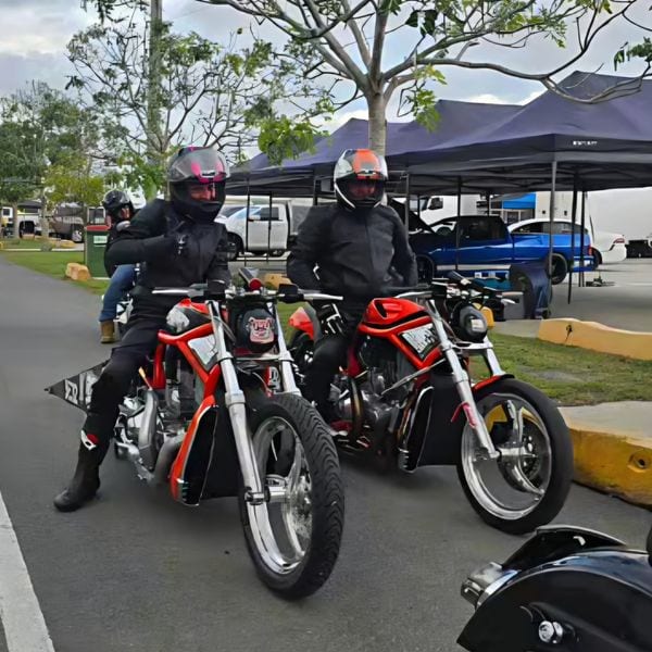 Jason and Bec on their Harley V-Rods — proud supporters of No Eye Deer Racing